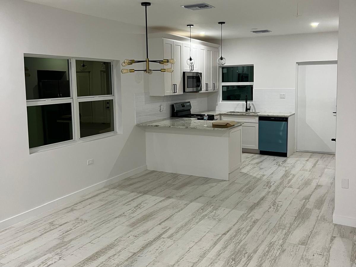 Refurbished kitchen and living space at 27 Boreal Street, West Bay