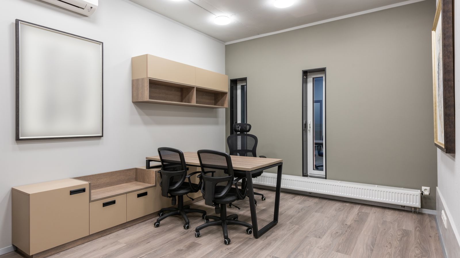 Staff room with built in storage, a meeting table and modern finishes